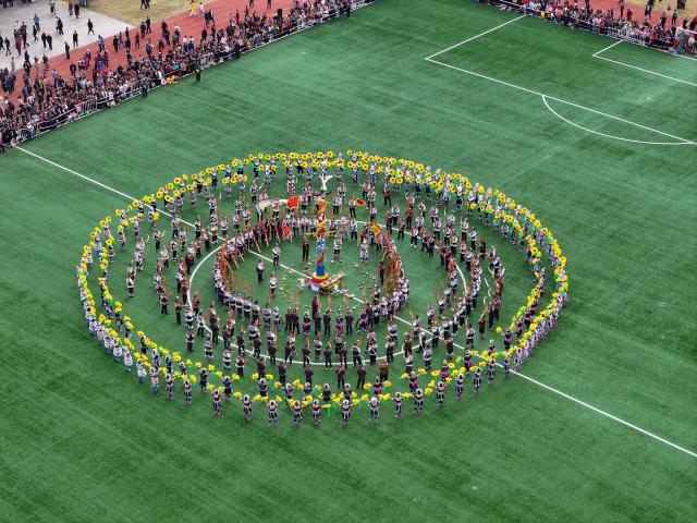 (251130) -- NANNING, Nov. 30, 2025 (Xinhua) -- An aerial drone photo taken on Nov. 29, 2025 shows local residents dancing to the accompaniment of Lusheng, a traditional reed-pipe wind instrument to celebrate Lusheng and horse fighting festival in Rongshui Miao Autonomous County, south China's Guangxi Zhuang Autonomous Region. Rongshui County has leveraged its unique cultural resources of Lusheng to strengthen the inheritance of Miao ethnic culture and empower rural revitalization. (Photo by Zheng Changhao/Xinhua)