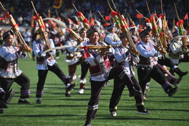 (251130) -- NANNING, Nov. 30, 2025 (Xinhua) -- People perform with Lusheng, a traditional reed-pipe wind instrument, to celebrate Lusheng and horse fighting festival in Rongshui Miao Autonomous County, south China's Guangxi Zhuang Autonomous Region, Nov. 29, 2025. Rongshui County has leveraged its unique cultural resources of Lusheng to strengthen the inheritance of Miao ethnic culture and empower rural revitalization. (Xinhua/Huang Xiaobang)