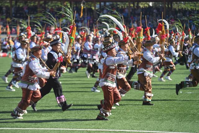 (251130) -- NANNING, Nov. 30, 2025 (Xinhua) -- People perform with Lusheng, a traditional reed-pipe wind instrument, to celebrate Lusheng and horse fighting festival in Rongshui Miao Autonomous County, south China's Guangxi Zhuang Autonomous Region, Nov. 29, 2025. Rongshui County has leveraged its unique cultural resources of Lusheng to strengthen the inheritance of Miao ethnic culture and empower rural revitalization. (Xinhua/Huang Xiaobang)