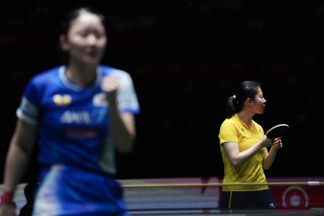 (251130) -- CHENGDU, Nov. 30, 2025 (Xinhua) -- Liu Yangzi (R) of Australia reacts during the women's singles match against Harimoto Miwa of Japan during the stage 1 group match between Japan and Australia at the ITTF Mixed Team World Cup 2025 in Chengdu, southwest China's Sichuan Province, Nov. 30, 2025. (Xinhua/Wang Ying)