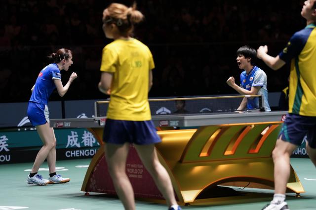 (251130) -- CHENGDU, Nov. 30, 2025 (Xinhua) -- Hayata Hina (1st L)/Togami Shunsuke (2nd R) of Japan celebrate during the mixed doubles match against Wu Jiamuwa/Luu Finn of Australia during the stage 1 group match between Japan and Australia at the ITTF Mixed Team World Cup 2025 in Chengdu, southwest China's Sichuan Province, Nov. 30, 2025. (Xinhua/Wang Ying)