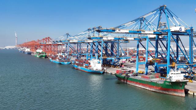 (251130) -- QINZHOU, Nov. 30, 2025 (Xinhua) -- A drone photo taken on Nov. 29, 2025 shows vessels at the Qinzhou Port in Qinzhou City, south China's Guangxi Zhuang Autonomous Region. The New International Land-Sea Trade Corridor (ILSTC), a key logistics route connecting western China to global markets, had transported a cumulative total of more than 5 million twenty-foot equivalent units (TEUs) of cargo as of Saturday, according to China Railway Nanning Group Co., Ltd. (Xinhua/Zhang Ailin)
