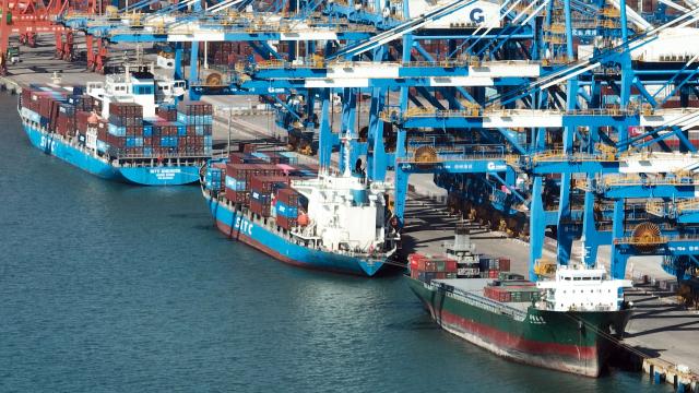 (251130) -- QINZHOU, Nov. 30, 2025 (Xinhua) -- A drone photo taken on Nov. 29, 2025 shows vessels at the Qinzhou Port in Qinzhou City, south China's Guangxi Zhuang Autonomous Region. The New International Land-Sea Trade Corridor (ILSTC), a key logistics route connecting western China to global markets, had transported a cumulative total of more than 5 million twenty-foot equivalent units (TEUs) of cargo as of Saturday, according to China Railway Nanning Group Co., Ltd. (Xinhua/Zhang Ailin)