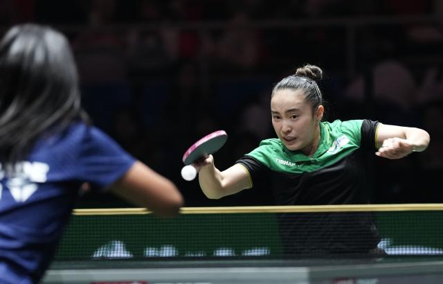 (251130) -- CHENGDU, Nov. 30, 2025 (Xinhua) -- Laura Watanabe of Brazil hits a return during the women's singles match against Prithika Pavade of France during the stage 1 group match between France and Brazil at the ITTF Mixed Team World Cup 2025 in Chengdu, southwest China's Sichuan Province, Nov. 30, 2025. (Xinhua/Wang Ying)