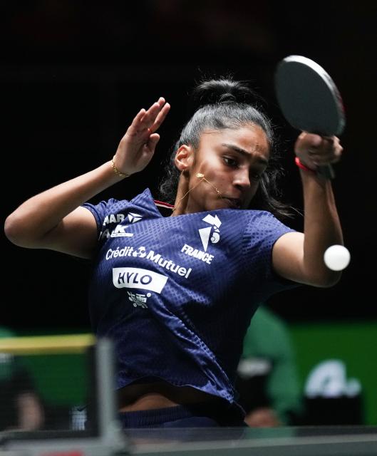 (251130) -- CHENGDU, Nov. 30, 2025 (Xinhua) -- Prithika Pavade of France hits a return during the women's singles match against Laura Watanabe of Brazil during the stage 1 group match between France and Brazil at the ITTF Mixed Team World Cup 2025 in Chengdu, southwest China's Sichuan Province, Nov. 30, 2025. (Xinhua/Wang Ying)