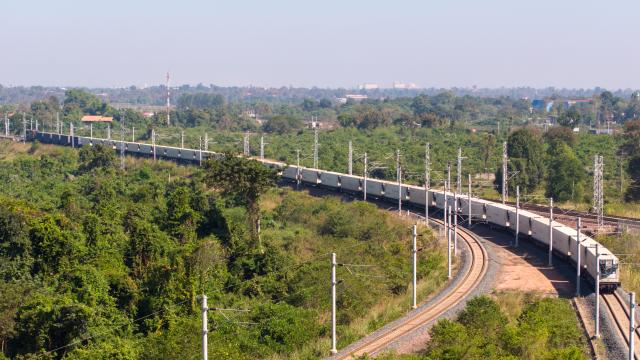 (251130) -- VIENTIANE, Nov. 30, 2025 (Xinhua) -- An aerial drone photo shows a container train carrying 1,000 tons of cassava starch bound for Zhengzhou, capital of central China's Henan Province, departing from the Vientiane South Station on the China-Laos Railway in Vientiane, capital of Laos, Nov. 29, 2025. TO GO WITH "Laos launches first cassava starch export to China by full train" (Photo by Kaikeo Saiyasane/Xinhua)