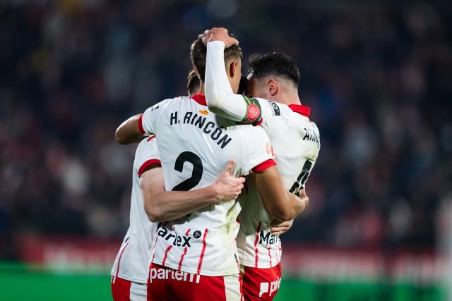 (251201) -- GIRONA, Dec. 1, 2025 (Xinhua) -- Hugo Rincon (C) and Arnau Martinez (R) of Girona FC celebrate during the La Liga football match between Girona FC and Real Madrid CF in Montilivi Stadium, Girona, Spain, on Nov. 30, 2025. (Photo by Joan Gosa/Xinhua)