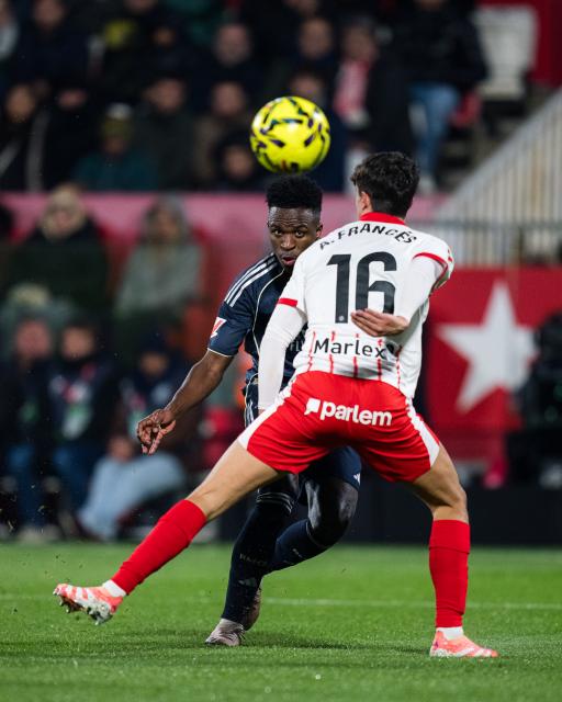 (251201) -- GIRONA, Dec. 1, 2025 (Xinhua) -- Vinicius Junior (L) of Real Madrid CF competes during the La Liga football match between Girona FC and Real Madrid CF in Montilivi Stadium, Girona, Spain, on Dec. 1, 2025. (Photo by Joan Gosa/Xinhua)
