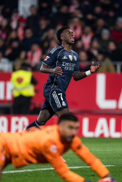 (251201) -- GIRONA, Dec. 1, 2025 (Xinhua) -- Vinicius Junior (rear) of Real Madrid CF reacts during the La Liga football match between Girona FC and Real Madrid CF in Montilivi Stadium, Girona, Spain, on Dec. 1, 2025. (Photo by Joan Gosa/Xinhua)