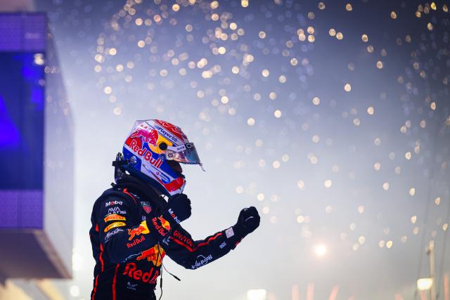 (251201) -- DOHA, Dec. 1, 2025 (Xinhua) -- Red Bull's Dutch Driver Max Verstappen celebrates his win after the Formula One Qatar Grand Prix at the Lusail International Circuit in Doha, Qatar, on Nov. 30, 2025. (Photo by Liu Minghao/Xinhua)