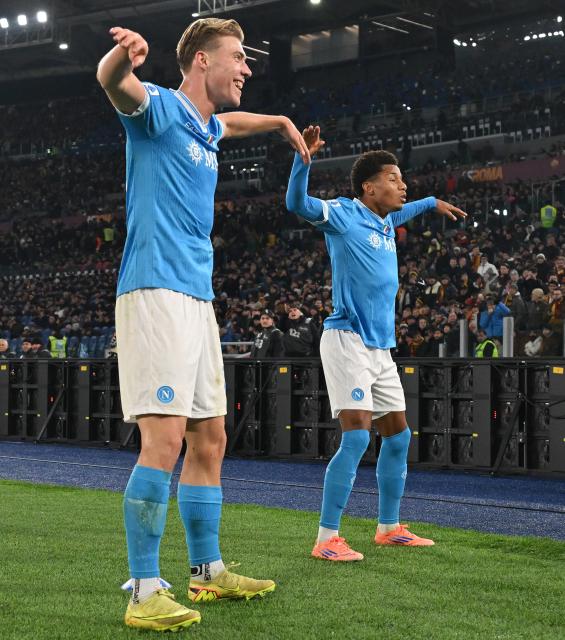 (251201) -- ROME, Dec. 1, 2025 (Xinhua) -- Napoli's David Neres (R) celebrates his goal with his teammate Rasmus Hojlund during a Serie A soccer match between Roma and Napoli in Rome, Italy, Nov. 30, 2025. (Photo by Alberto Lingria/Xinhua)