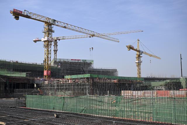 (251201) -- HUAIBEI, Dec. 1, 2025 (Xinhua) -- This photo taken on Nov. 30, 2025 shows the construction site of a square in front of Huaibei West Railway Station in Huaibei, east China's Anhui Province. The Huaibei West Railway Station is along an intercity railway stretching about 161 kilometers which will link the cities of Huaibei, Suzhou and Bengbu in Anhui Province. (Xinhua/Huang Bohan)