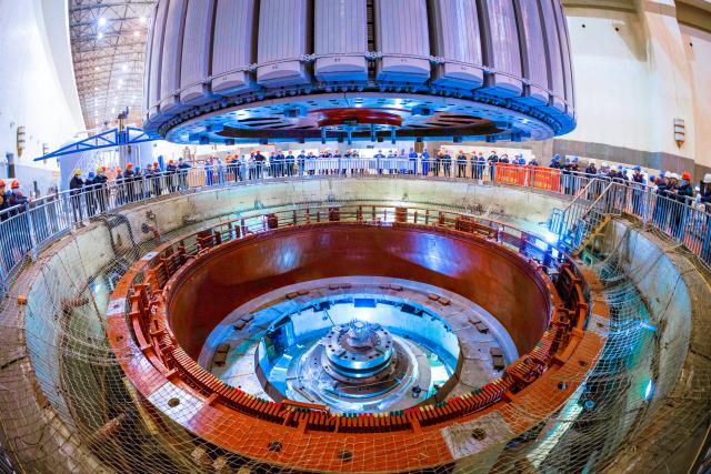 (251201) -- BEIJING, Dec. 1, 2025 (Xinhua) -- This photo taken on Nov. 30, 2025 shows the hoisted rotor of the No. 5 generator unit of the Shuikou Hydropower Station in Xiongjiang Town of Minqing County, southeast China's Fujian Province. The No. 5 generator unit of the Shuikou Hydropower Station began an overhaul recently, with a planned total construction period of 175 days. (Xinhua/Zhou Yi)