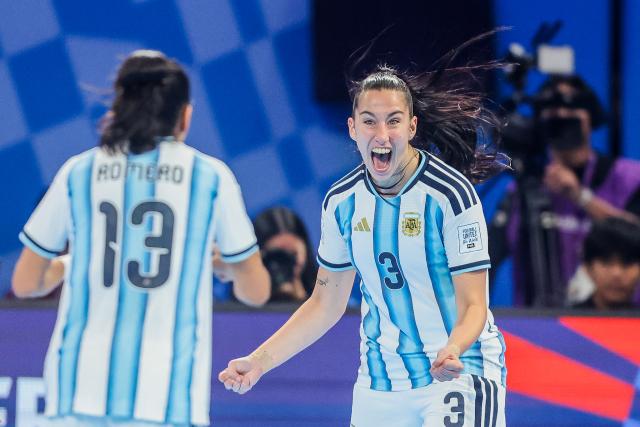 (251201) -- PASIG CITY, Dec. 1, 2025 (Xinhua) -- Lucia Rossi (R) of Argentina celebrates after scoring a goal during the quarterfinal match between Argentina and Colombia at the FIFA Futsal Women's World Cup 2025 in Pasig City, the Philippines, Dec. 1, 2025. (Xinhua/Rouelle Umali)