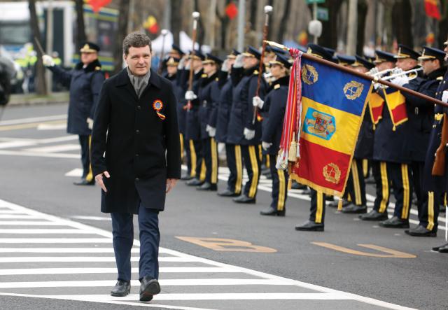 (251201) -- BUCHAREST, Dec. 1, 2025 (Xinhua) -- Romanian President Nicusor Dan attends a military parade celebrating Romania's National Day in Bucharest, Romania, on Dec. 1, 2025. (Photo by Cristian Cristel/Xinhua)