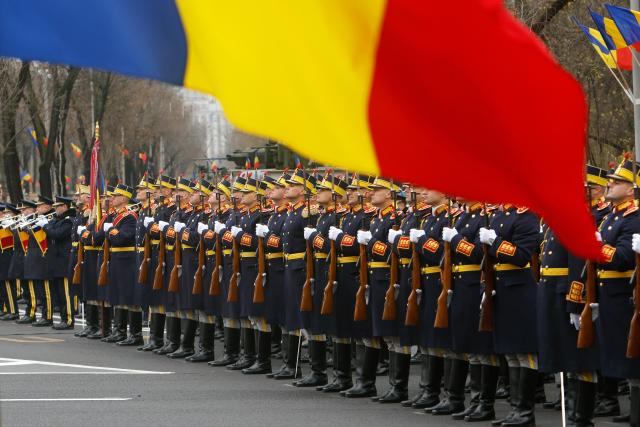 (251201) -- BUCHAREST, Dec. 1, 2025 (Xinhua) -- Soldiers attend a military parade celebrating Romania's National Day in Bucharest, Romania, on Dec. 1, 2025. (Photo by Cristian Cristel/Xinhua)