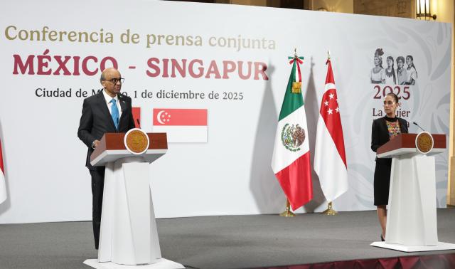 (251201) -- MEXICO CITY, Dec. 1, 2025 (Xinhua) -- Visiting Singaporean President Tharman Shanmugaratnam (L) speaks during a joint press conference with Mexican President Claudia Sheinbaum at the National Palace in Mexico City, Mexico, Dec. 1, 2025. (Photo by Francisco Canedo/Xinhua)