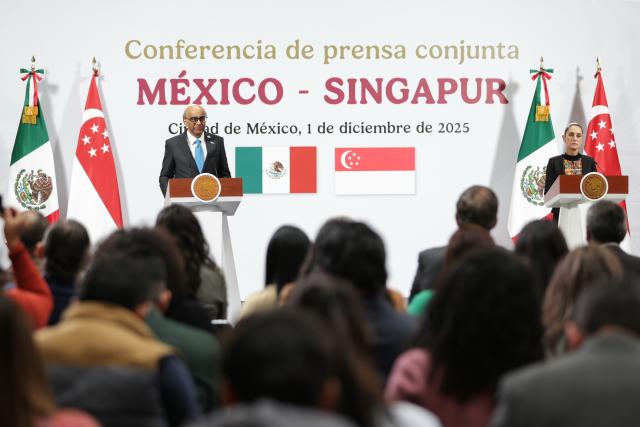 (251201) -- MEXICO CITY, Dec. 1, 2025 (Xinhua) -- Visiting Singaporean President Tharman Shanmugaratnam (L) speaks during a joint press conference with Mexican President Claudia Sheinbaum at the National Palace in Mexico City, Mexico, Dec. 1, 2025. (Photo by Francisco Canedo/Xinhua)