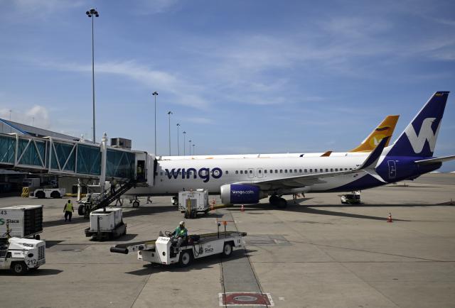 (251201) -- CARACAS, Dec. 1, 2025 (Xinhua) -- Passenger aircraft are pictured at the Simon Bolivar International Airport in Maiquetia, Venezuela, Dec. 1, 2025. (Xinhua/Li Muzi)