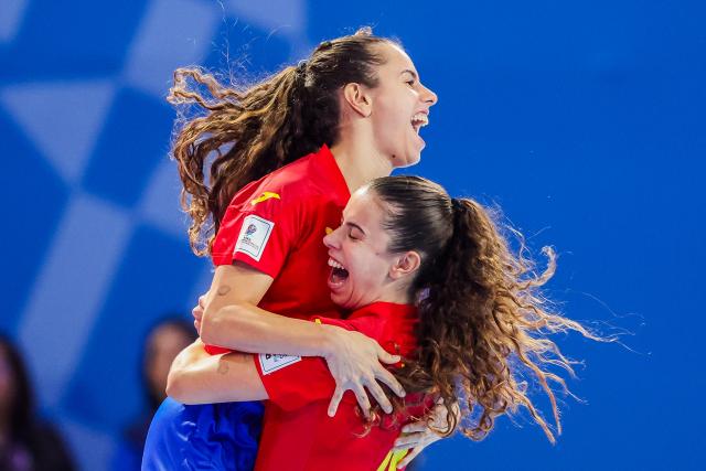 (251202) -- PASIG CITY, Dec. 2, 2025 (Xinhua) -- Laura Cordoba and Irene Cordoba (L) of Spain celebrate after scoring a goal during the quarterfinal match between Spain and Morocco at the FIFA Futsal Women's World Cup 2025 in Pasig City, the Philippines, Dec. 1, 2025. (Xinhua/Rouelle Umali)