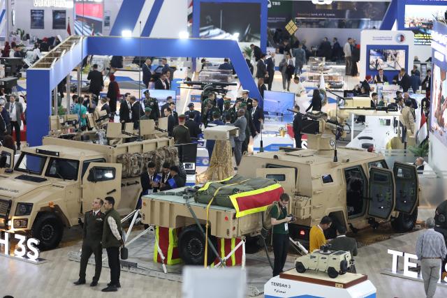 (251202) -- CAIRO, Dec. 2, 2025 (Xinhua) -- People visit the Egypt Defense Expo in Cairo, Egypt, on Dec. 1, 2025. The four-day Egypt Defense Expo, being held at the Egypt International Exhibition Centre, features over 400 defense and security companies displaying the latest military technology, equipment and systems across land, sea and air domains, and attracts military personnel, government officials, international delegations and industry professionals. (Xinhua/Ahmed Gomaa)