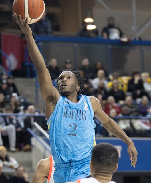 (251202) -- TORONTO, Dec. 2, 2025 (Xinhua) -- Domnick Bridgewater of Bahamas goes up for a layup during the first round group match of the FIBA Basketball World Cup 2027 Americas Qualifiers between Canada and Bahamas in Toronto, Canada, on Dec. 1, 2025. (Photo by Zou Zheng/Xinhua)