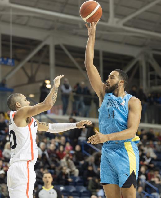 (251202) -- TORONTO, Dec. 2, 2025 (Xinhua) -- Isaiah Mobley (R) of Bahamas shoots during the first round group match of the FIBA Basketball World Cup 2027 Americas Qualifiers between Canada and Bahamas in Toronto, Canada, on Dec. 1, 2025. (Photo by Zou Zheng/Xinhua)