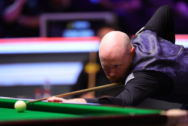 (251202) -- YORK, Dec. 2, 2025 (Xinhua) -- Gary Wilson of England competes during the first round match against Zhang Anda of China at the 2025 UK Snooker Championship in York, Britain, Dec. 1, 2025. (Photo by Zhai Zheng/Xinhua)
