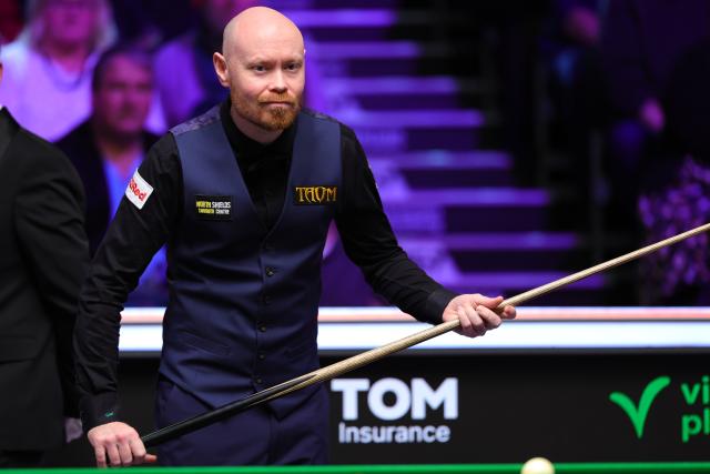 (251202) -- YORK, Dec. 2, 2025 (Xinhua) -- Gary Wilson of England competes during the first round match against Zhang Anda of China at the 2025 UK Snooker Championship in York, Britain, Dec. 1, 2025. (Photo by Zhai Zheng/Xinhua)