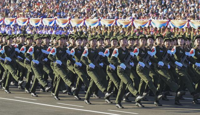 (251202) -- VIENTIANE, Dec. 2, 2025 (Xinhua) -- This photo taken on Dec. 2, 2025 shows a scene during an event in Vientiane to celebrate the 50th anniversary of the founding of the Lao People's Democratic Republic. A grand mass march and a military parade were held in Vientiane on Tuesday. (Xinhua/Gao Jie)