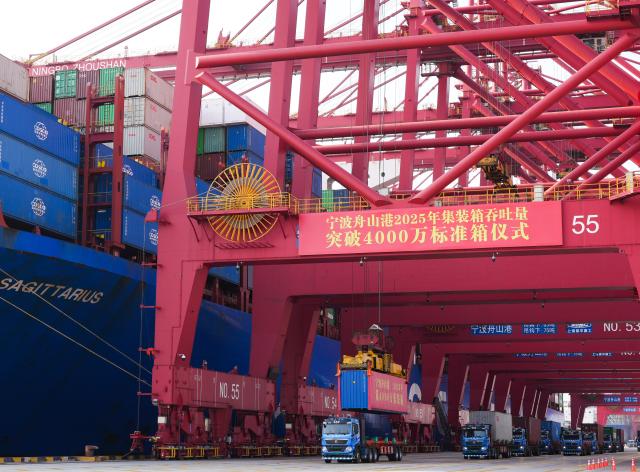 (251202) -- NINGBO, Dec. 2, 2025 (Xinhua) -- This photo taken on Dec. 2, 2025 shows a container being hoisted at the Meishan port area of the Ningbo-Zhoushan Port in east China's Zhejiang Province. A container adorned in red was steadily loaded onto a container ship here on Tuesday, marking the Ningbo-Zhoushan Port's annual container throughput exceeding 40 million TEUs for the first time.
   The Ningbo-Zhoushan Port is the only port in the world that has handled over 1 billion tonnes of cargo annually for 16 consecutive years. (Xinhua/Weng Xinyang)