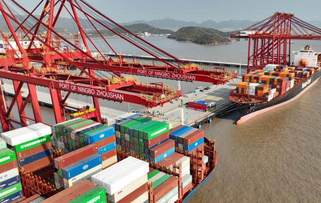(251202) -- NINGBO, Dec. 2, 2025 (Xinhua) -- An aerial drone photo taken on Dec. 2, 2025 shows container ships berthing at the Meishan port area of the Ningbo-Zhoushan Port in east China's Zhejiang Province. A container adorned in red was steadily loaded onto a container ship here on Tuesday, marking the Ningbo-Zhoushan Port's annual container throughput exceeding 40 million TEUs for the first time.
   The Ningbo-Zhoushan Port is the only port in the world that has handled over 1 billion tonnes of cargo annually for 16 consecutive years. (Xinhua/Weng Xinyang)