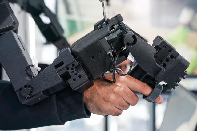 (251202) -- HEFEI, Dec. 2, 2025 (Xinhua) -- Ahmed Medhat Mostafa Elsayed tries operating a parcel sorting robot at the pre-training venue for the Embodied Artificial Intelligence (EAI) robots data collection in Hefei, east China's Anhui Province, Nov. 28, 2025. The 23-year-old Ahmed Medhat Mostafa Elsayed is an Egyptian student who is currently doing research in particle physics at the University of Science and Technology of China in Hefei.
    Elsayed came to China at the age of ten in 2012. Influenced by his father, who works in the physics area, Elsayed gradually developed a strong interest in physics. After graduating from Sichuan University of Science and Engineering with a bachelor's degree in physics two years ago, he entered the University of Science and Technology of China for his postgraduate study. 
    Now Elsayed, whose research topic focuses on heavy neutrinos, plans to apply for the doctoral degree here, hoping he could make some influential scientific research achievements in the future and  could become a bridge on academic exchange between China and the world. (Xinhua/Du Yu)