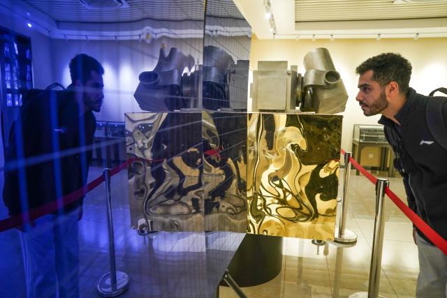 (251202) -- HEFEI, Dec. 2, 2025 (Xinhua) -- Ahmed Medhat Mostafa Elsayed looks at a model of a Quantum communication satellite at the history gallery of University of Science and Technology of China in Hefei, east China's Anhui Province, Nov. 28, 2025. The 23-year-old Ahmed Medhat Mostafa Elsayed is an Egyptian student who is currently doing research in particle physics at the University of Science and Technology of China in Hefei.
    Elsayed came to China at the age of ten in 2012. Influenced by his father, who works in the physics area, Elsayed gradually developed a strong interest in physics. After graduating from Sichuan University of Science and Engineering with a bachelor's degree in physics two years ago, he entered the University of Science and Technology of China for his postgraduate study. 
    Now Elsayed, whose research topic focuses on heavy neutrinos, plans to apply for the doctoral degree here, hoping he could make some influential scientific research achievements in the future and  could become a bridge on academic exchange between China and the world. (Xinhua/Du Yu)