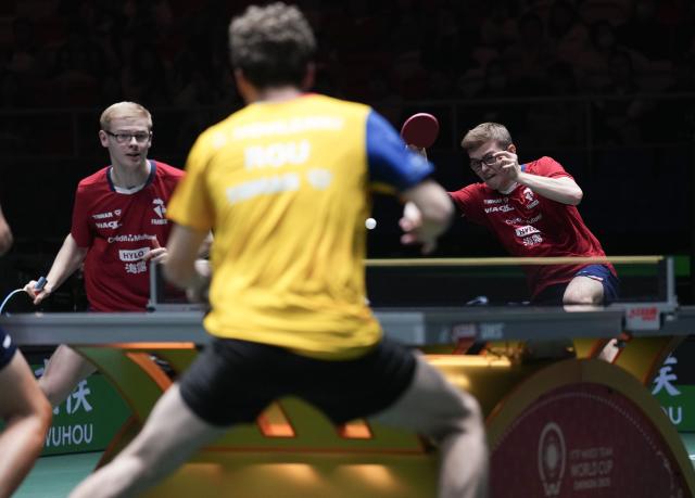 (251202) -- CHENGDU, Dec. 2, 2025 (Xinhua) -- Alexis Lebrun (R)/Felix Lebrun of France compete in the men's doubles match against Darius Movileanu/Eduard Ionescu of Romania during the stage 1 group match between France and Romania at the ITTF Mixed Team World Cup 2025 in Chengdu, southwest China's Sichuan Province, Dec. 2, 2025. (Xinhua/Wang Ying)