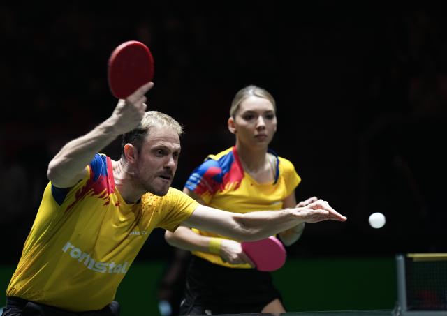 (251202) -- CHENGDU, Dec. 2, 2025 (Xinhua) -- Ovidiu Ionescu (L)/Bernadette Szocs of Romania compete in the mixed doubles match against Alexis Lebrun/Yuan Jia Nan of France during the stage 1 group match between France and Romania at the ITTF Mixed Team World Cup 2025 in Chengdu, southwest China's Sichuan Province, Dec. 2, 2025. (Xinhua/Wang Ying)