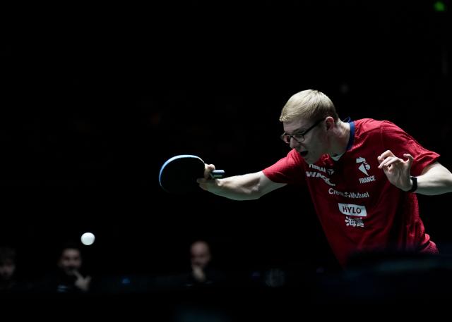 (251202) -- CHENGDU, Dec. 2, 2025 (Xinhua) -- Felix Lebrun of France competes in the men's singles match against Eduard Ionescu of Romania during the stage 1 group match between France and Romania at the ITTF Mixed Team World Cup 2025 in Chengdu, southwest China's Sichuan Province, Dec. 2, 2025. (Xinhua/Wang Ying)