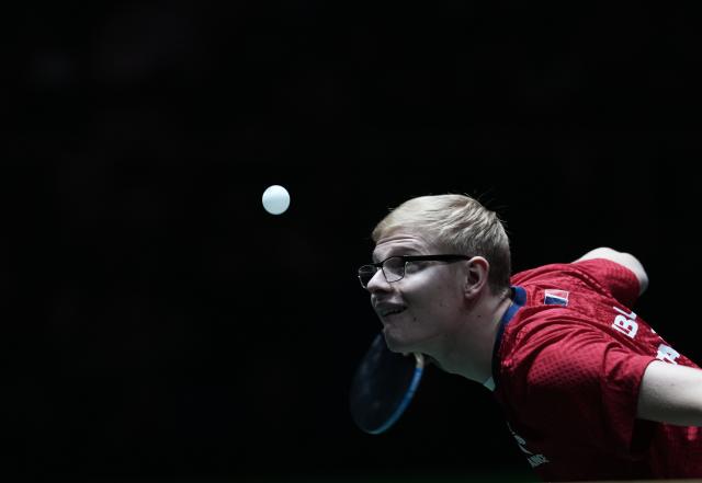 (251202) -- CHENGDU, Dec. 2, 2025 (Xinhua) -- Felix Lebrun of France competes in the men's singles match against Eduard Ionescu of Romania during the stage 1 group match between France and Romania at the ITTF Mixed Team World Cup 2025 in Chengdu, southwest China's Sichuan Province, Dec. 2, 2025. (Xinhua/Wang Ying)