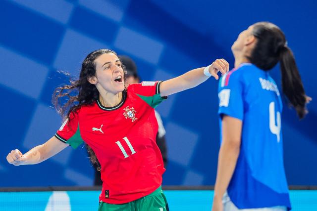 (251202) -- PASIG CITY, Dec. 2, 2025 (Xinhua) -- Carolina Pedreira (L) of Portugal celebrates after scoring a goal during the quarterfinal match between Portugal and Italy at the FIFA Futsal Women's World Cup 2025 in Pasig City, the Philippines, on Dec. 2, 2025. (Xinhua/Rouelle Umali)