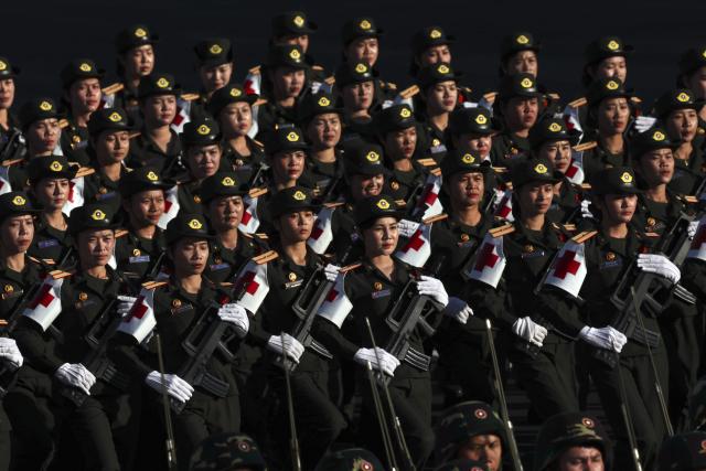 (251202) -- VIENTIANE, Dec. 2, 2025 (Xinhua) -- A grand parade is held to celebrate the 50th anniversary of the founding of the Lao People's Democratic Republic in Vientiane, Laos, Dec. 2, 2025. (Xinhua/Yao Dawei)