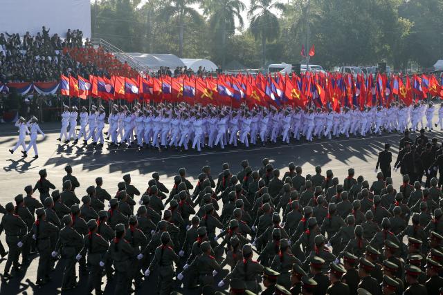 (251202) -- VIENTIANE, Dec. 2, 2025 (Xinhua) -- A grand parade is held to celebrate the 50th anniversary of the founding of the Lao People's Democratic Republic in Vientiane, Laos, Dec. 2, 2025. (Xinhua/Yao Dawei)
