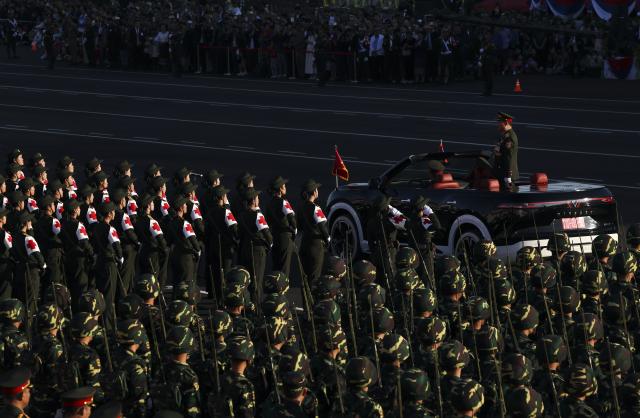 (251202) -- VIENTIANE, Dec. 2, 2025 (Xinhua) -- A grand parade is held to celebrate the 50th anniversary of the founding of the Lao People's Democratic Republic in Vientiane, Laos, Dec. 2, 2025. (Xinhua/Yao Dawei)
