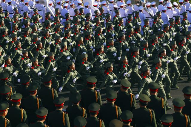 (251202) -- VIENTIANE, Dec. 2, 2025 (Xinhua) -- A grand parade is held to celebrate the 50th anniversary of the founding of the Lao People's Democratic Republic in Vientiane, Laos, Dec. 2, 2025. (Xinhua/Yao Dawei)