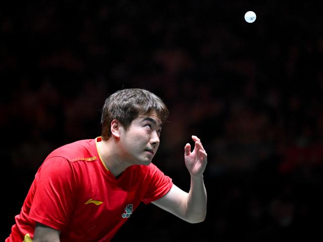 (251202) -- CHENGDU, Dec. 2, 2025 (Xinhua) -- Liang Jingkun of China competes in the men's singles match against Gustavo Gomez of Chile during the stage 1 group match between China and Chile at the ITTF Mixed Team World Cup 2025 in Chengdu, southwest China's Sichuan Province, Dec. 2, 2025. (Xinhua/Xu Bingjie)