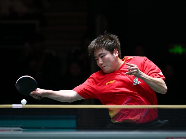 (251202) -- CHENGDU, Dec. 2, 2025 (Xinhua) -- Liang Jingkun of China competes in the men's singles match against Gustavo Gomez of Chile during the stage 1 group match between China and Chile at the ITTF Mixed Team World Cup 2025 in Chengdu, southwest China's Sichuan Province, Dec. 2, 2025. (Xinhua/Xu Bingjie)