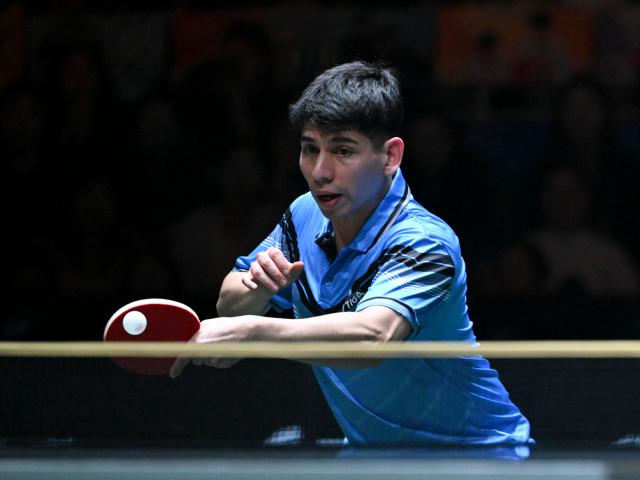 (251202) -- CHENGDU, Dec. 2, 2025 (Xinhua) -- Gustavo Gomez of Chile competes in the men's singles match against Liang Jingkun of China during the stage 1 group match between China and Chile at the ITTF Mixed Team World Cup 2025 in Chengdu, southwest China's Sichuan Province, Dec. 2, 2025. (Xinhua/Xu Bingjie)