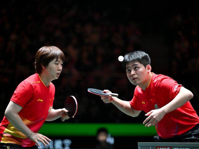 (251202) -- CHENGDU, Dec. 2, 2025 (Xinhua) -- Kuai Man/Lin Shidong (R) of China compete in the mixed doubles match against Nicolas Burgos/Paulina Vega of Chile during the stage 1 group match between China and Chile at the ITTF Mixed Team World Cup 2025 in Chengdu, southwest China's Sichuan Province, Dec. 2, 2025. (Xinhua/Xu Bingjie)