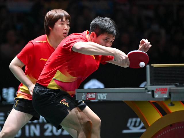 (251202) -- CHENGDU, Dec. 2, 2025 (Xinhua) -- Kuai Man/Lin Shidong (R) of China compete in the mixed doubles match against Nicolas Burgos/Paulina Vega of Chile during the stage 1 group match between China and Chile at the ITTF Mixed Team World Cup 2025 in Chengdu, southwest China's Sichuan Province, Dec. 2, 2025. (Xinhua/Xu Bingjie)