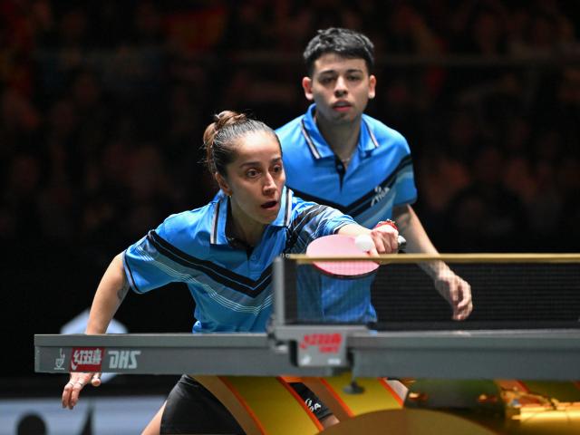 (251202) -- CHENGDU, Dec. 2, 2025 (Xinhua) -- Nicolas Burgos/Paulina Vega (L) of Chile compete in the mixed doubles match against Kuai Man/Lin Shidong of China during the stage 1 group match between China and Chile at the ITTF Mixed Team World Cup 2025 in Chengdu, southwest China's Sichuan Province, Dec. 2, 2025. (Xinhua/Xu Bingjie)
