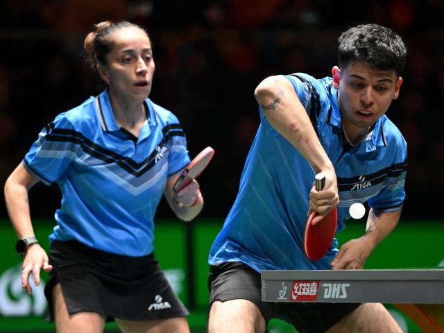 (251202) -- CHENGDU, Dec. 2, 2025 (Xinhua) -- Nicolas Burgos (R)/Paulina Vega of Chile compete in the mixed doubles match against Kuai Man/Lin Shidong of China during the stage 1 group match between China and Chile at the ITTF Mixed Team World Cup 2025 in Chengdu, southwest China's Sichuan Province, Dec. 2, 2025. (Xinhua/Xu Bingjie)